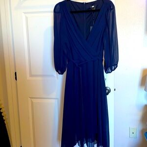 DKNY dress with wrap style top, shear puffed sleeves, hidden zipper, cloth belt